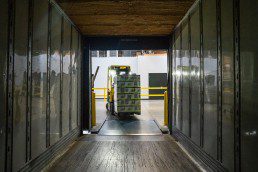 Inventory and forklift in shipping container